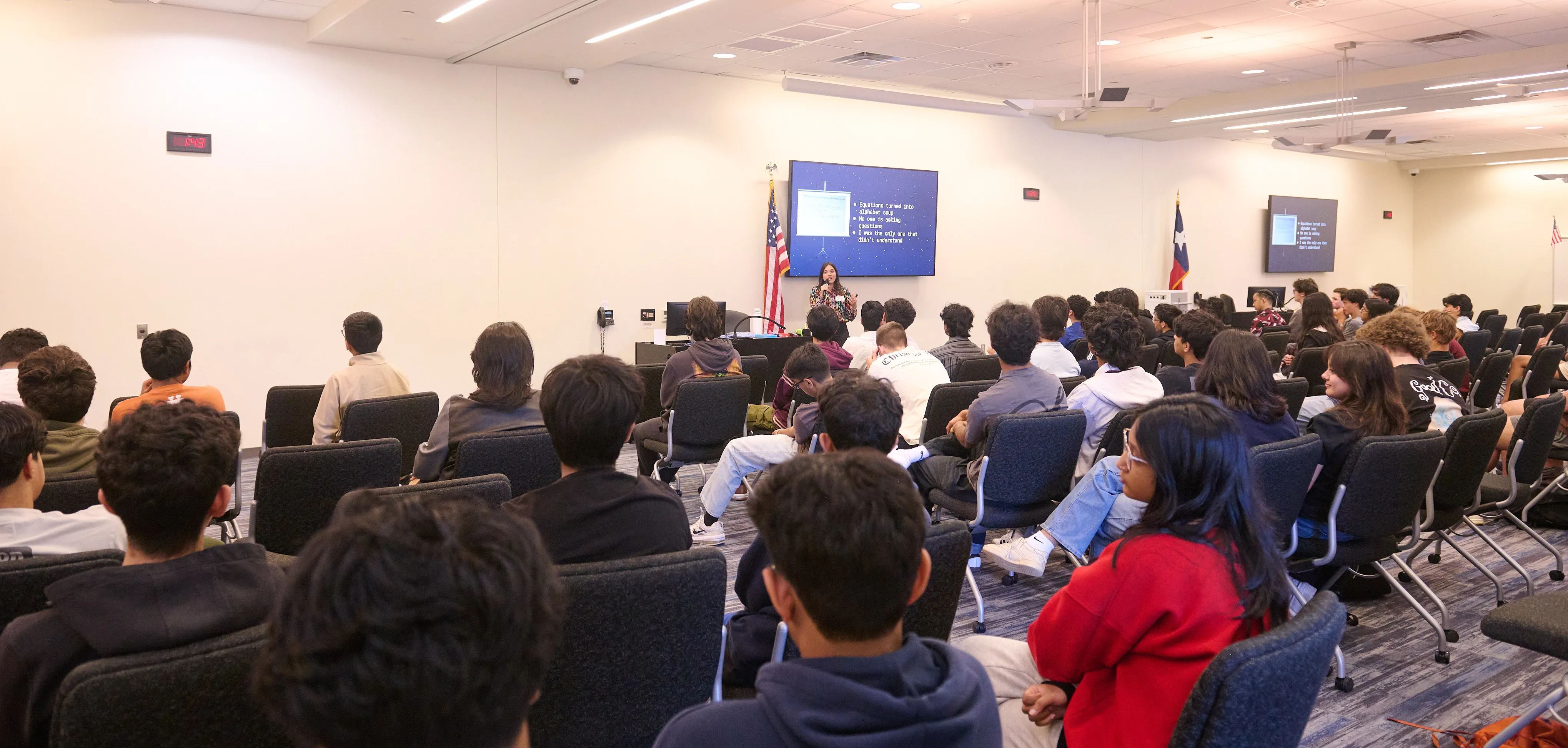 Aubrey Baker presenting aerospace engineering concepts to FISD CTEC students in a classroom setting