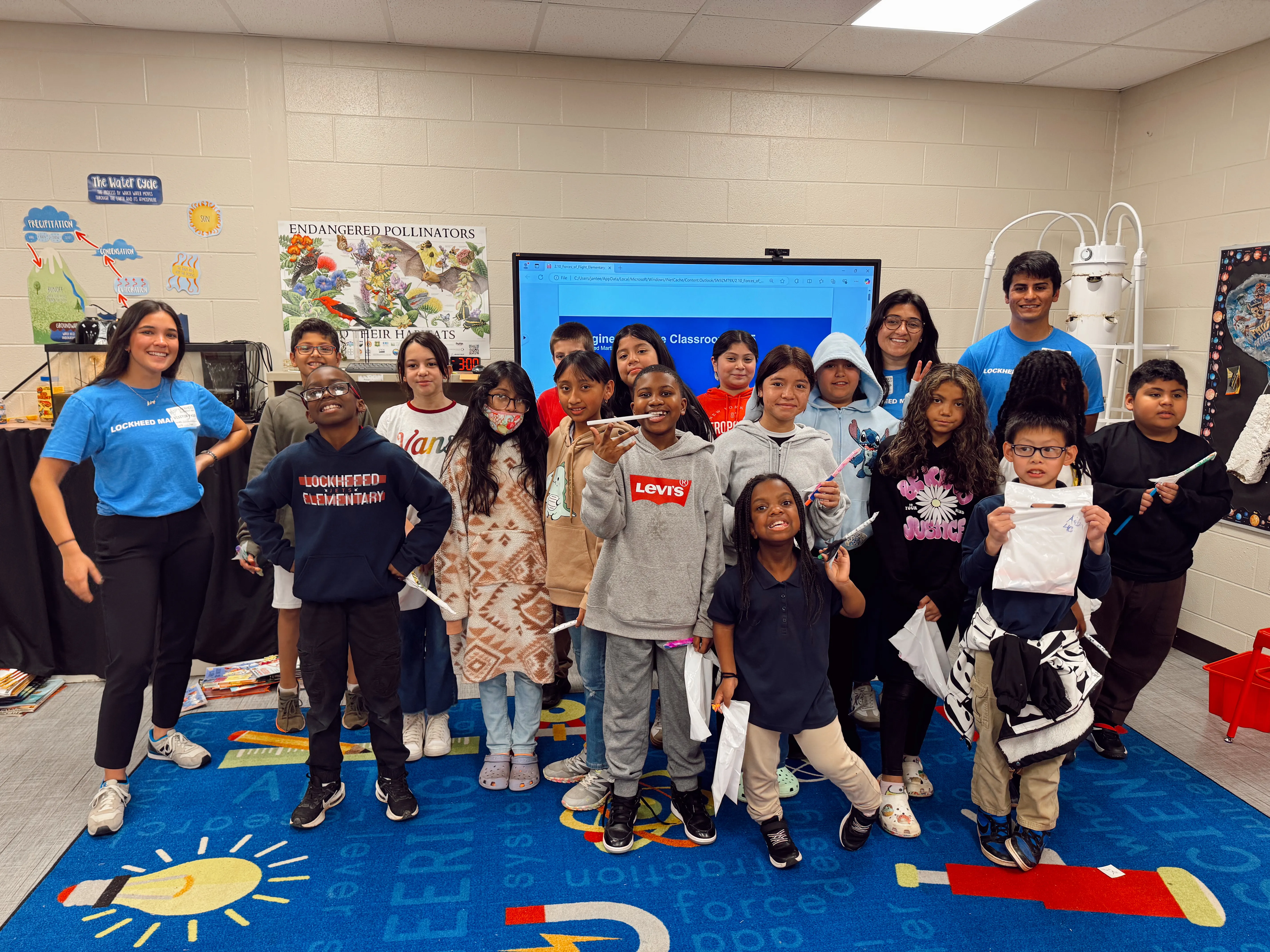 Aubrey Baker teaching aerospace engineering principles to students as part of the Engineers in the Classroom program